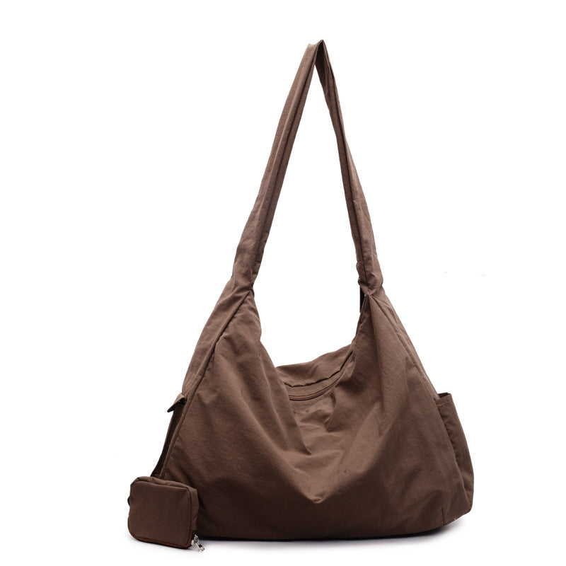Sac bandoulière hobo femme, grande capacité, idéal pour organiser vos essentiels avec style.