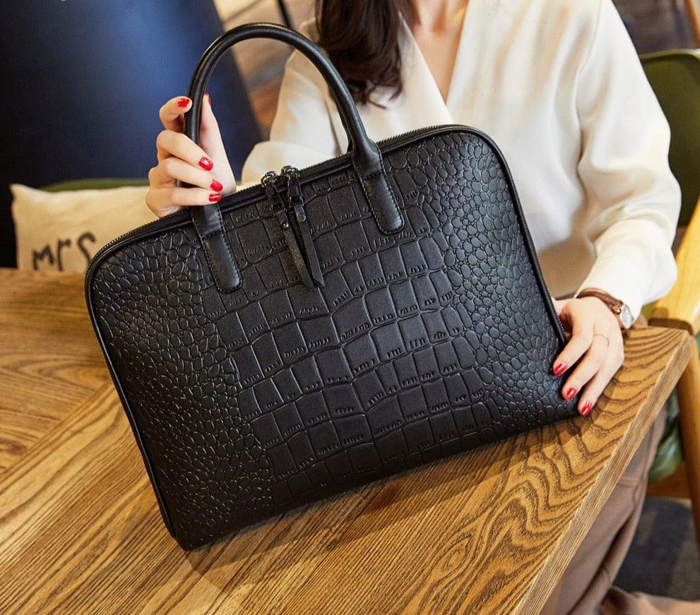 Sac à main professionnel femme, couleur noire, en cuir PU, élégant et pratique pour transporter un ordinateur.
