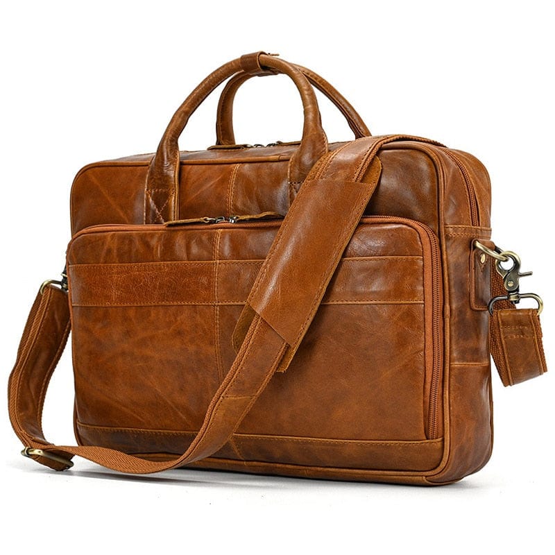 Sacoche professionnelle en cuir, ouverte, avec ordinateur portable, pour travail.