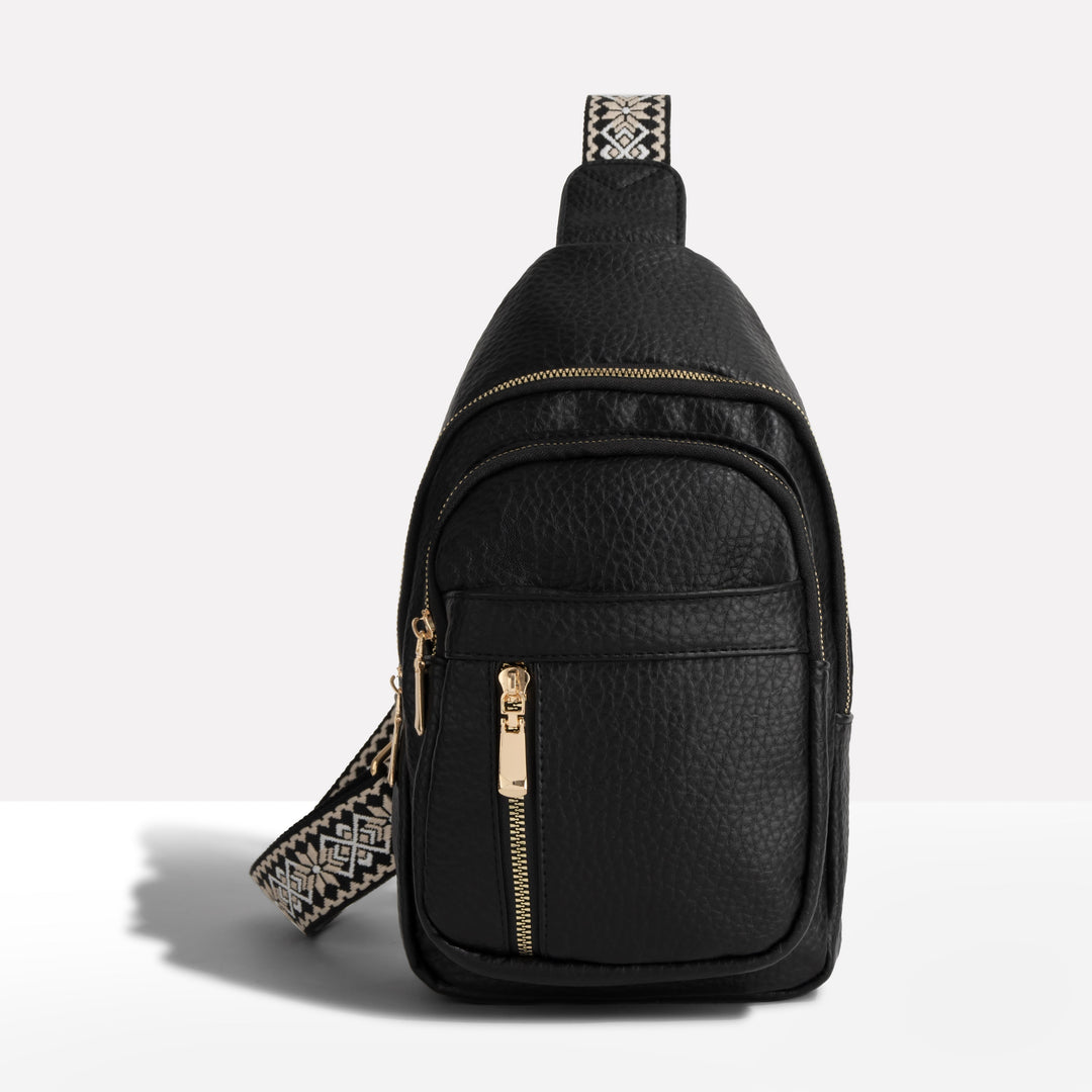 Sac sling bandoulière femme noir, sangle tissée à motifs géométriques, style moderne et pratique.