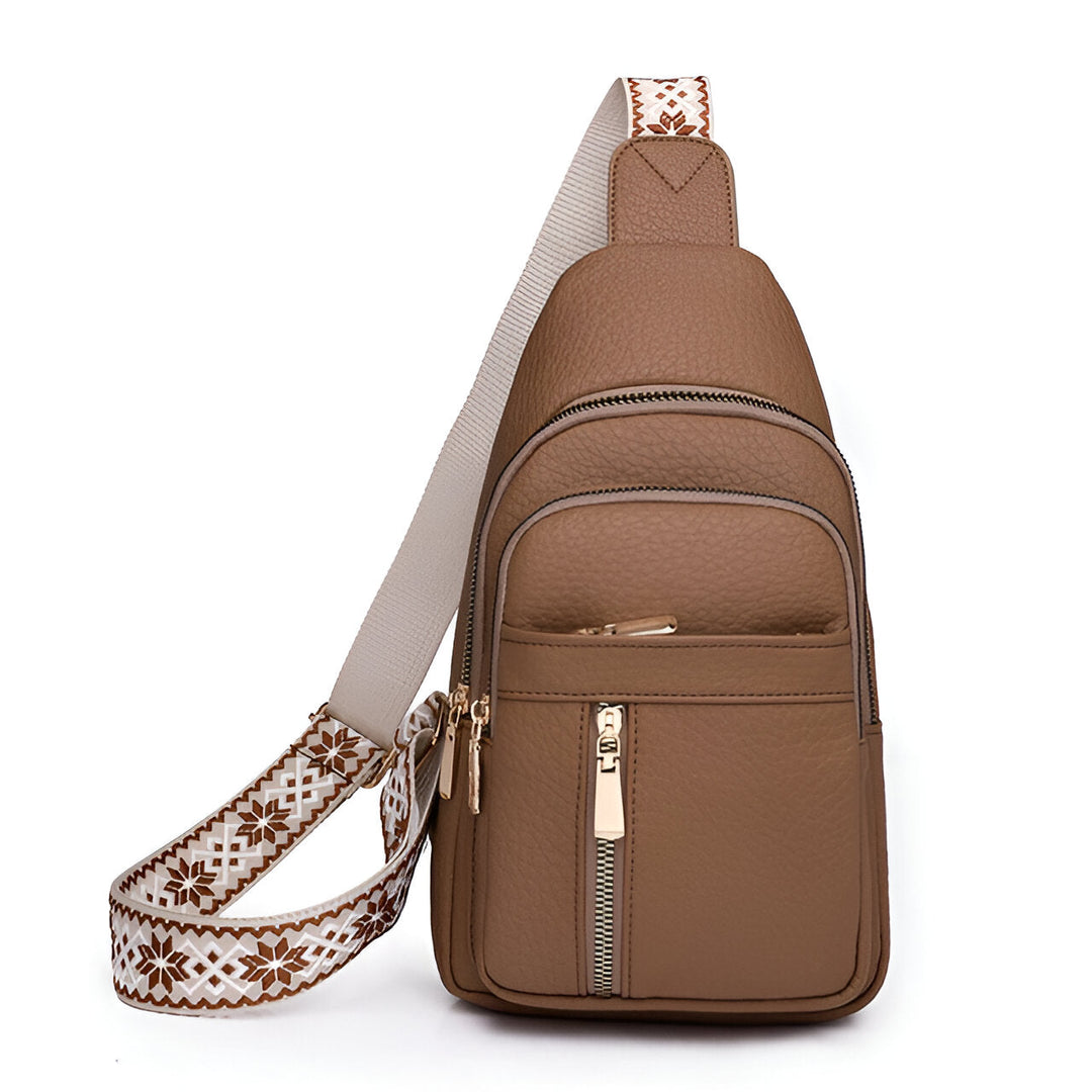 Sac sling femme rouge, accessoire de mode élégant avec sangle tissée pour un look urbain chic.