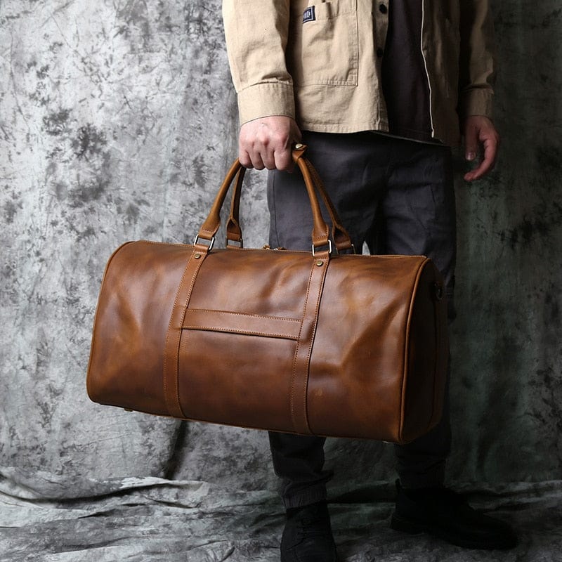 Sac de voyage homme en cuir véritable, spacieux et durable. Idéal pour tous les voyages.