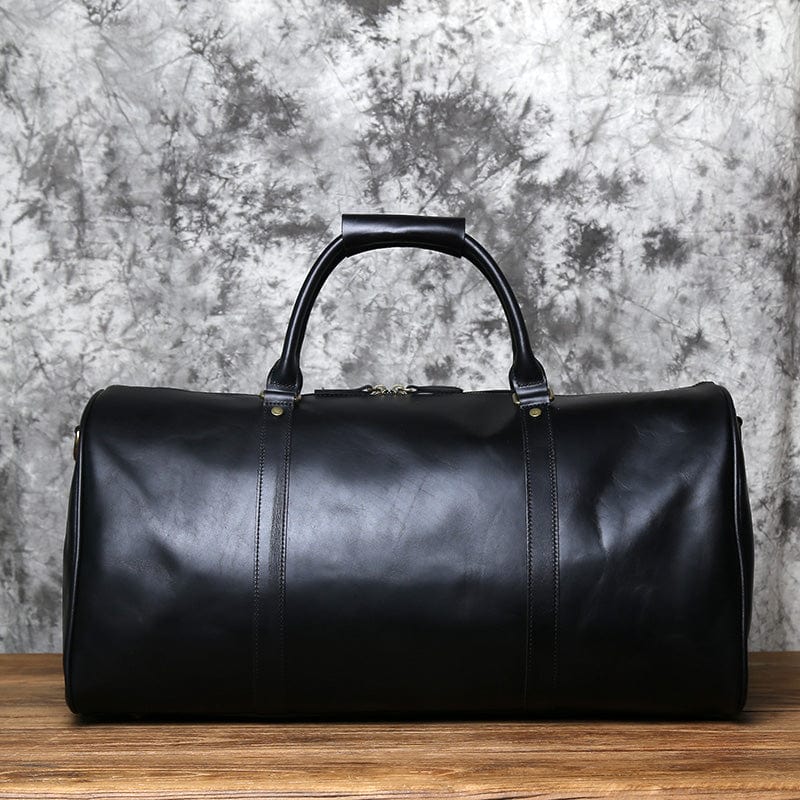Sac de voyage homme en cuir, idéal pour week-end chic. Bagage cabine élégant et robuste.