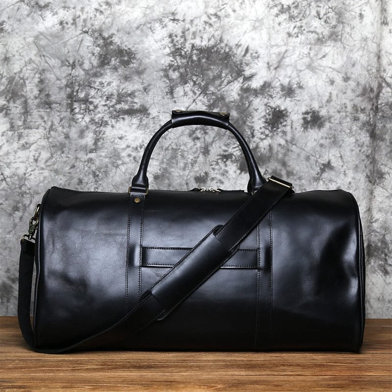 Élégant sac de voyage homme en cuir Côme, un accessoire de luxe pour le week-end et affaires.