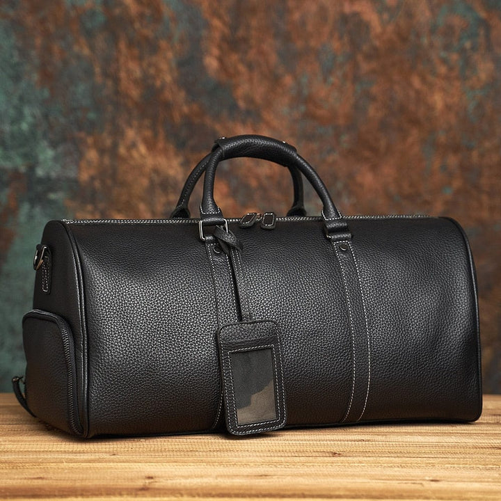 Maroquinerie homme: Sac de voyage Kaïs en cuir vintage, cadeau parfait. Qualité et style pour l'homme moderne.
