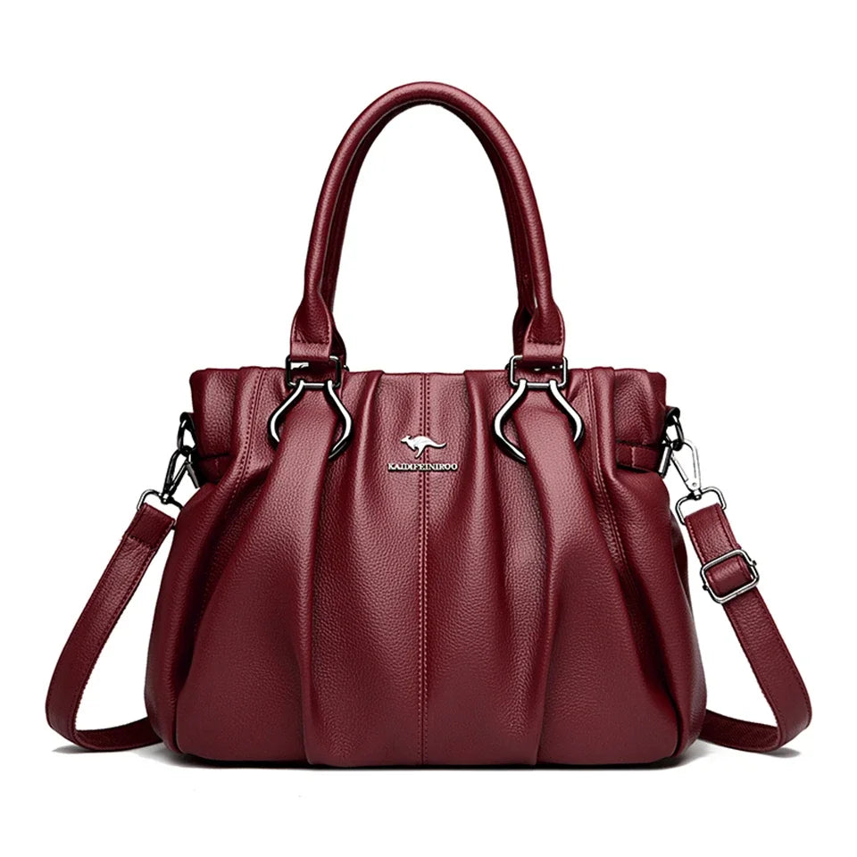 Accessoire mode chic: sac à main femme en cuir bordeaux. Élégant pour toutes occasions, peut être porté épaule ou main.