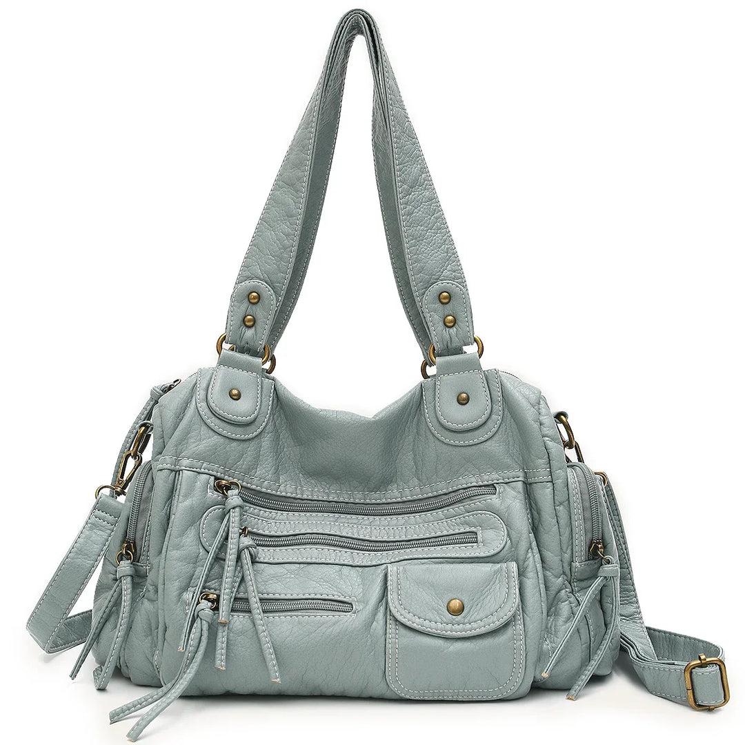 Sac cabas femme pratique et mode. Son style vintage en similicuir et sa bandoulière sont parfaits au quotidien.