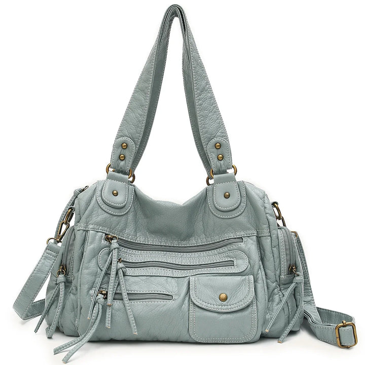 Sac cabas femme pratique et mode. Son style vintage en similicuir et sa bandoulière sont parfaits au quotidien.
