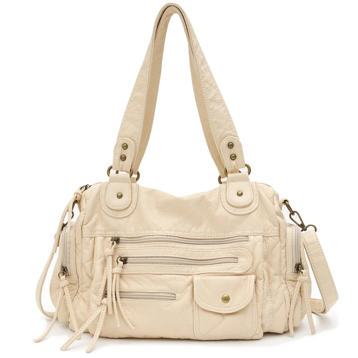 Sac cabas femme vintage polyvalent en similicuir. Spacieux et doté d'une bandoulière pour toutes occasions.