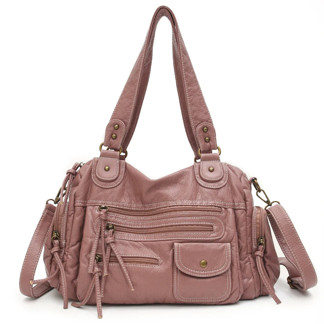 Accessoire mode femme : sac cabas vintage en similicuir noir, bandoulière pratique et intérieur spacieux.