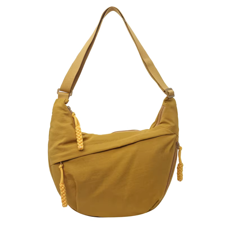 Sac banane femme déperlant en nylon, bandoulière réglable, accessoire mode indispensable.