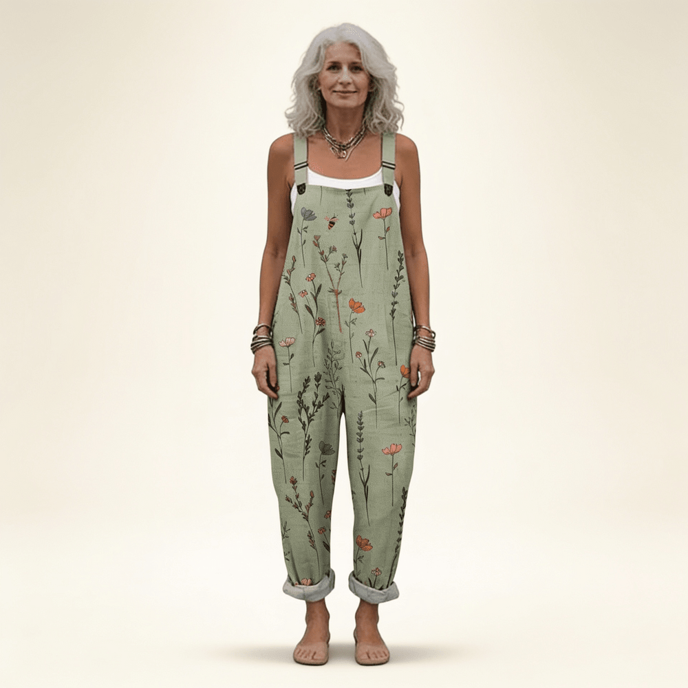 Combinaison femme fluide avec imprimé floral vert sauge, bretelles réglables et poches, style casual.