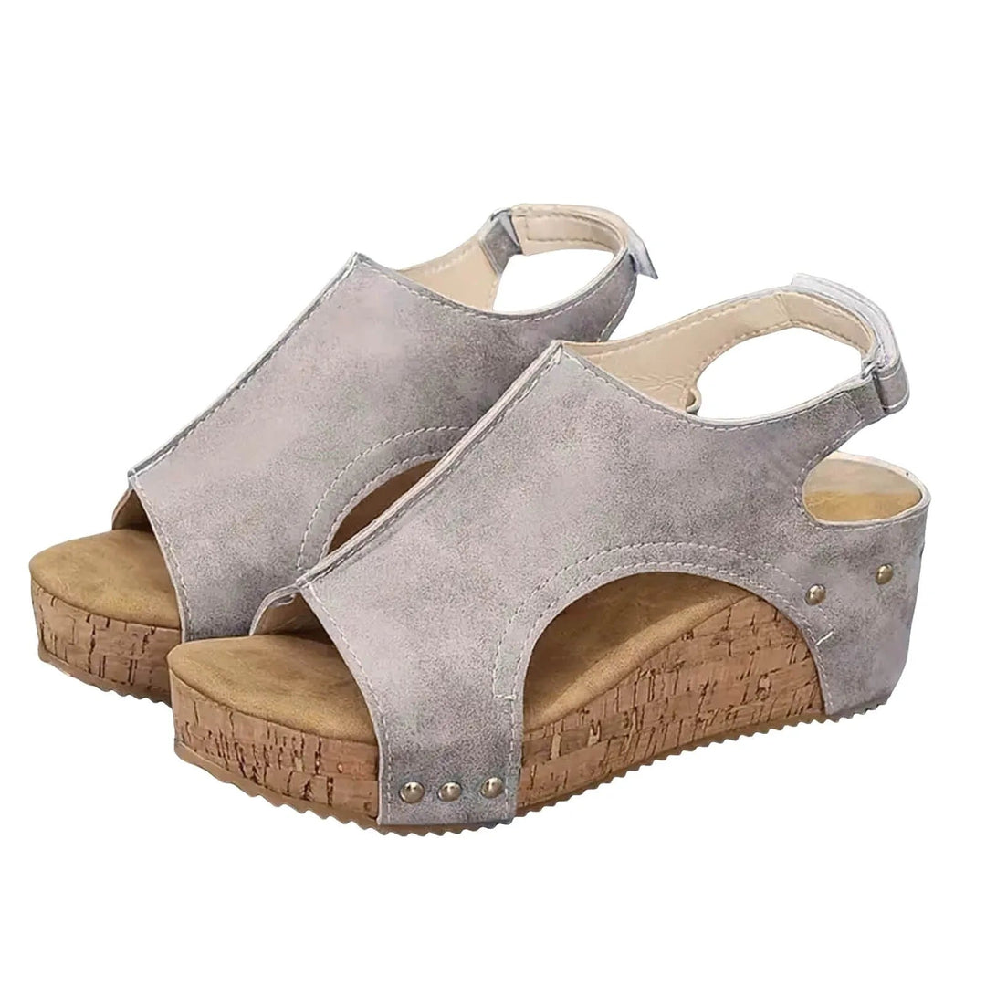 Sandales compensées confortables pour femmes, avec plateforme et soutien orthopédique pour un bien-être estival.