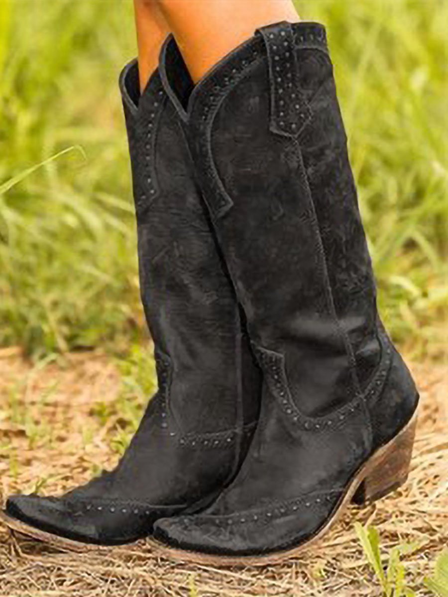 Bottes santiags femme tendance, hautes, cloutées, à bout pointu. Idéales pour un look western chic.