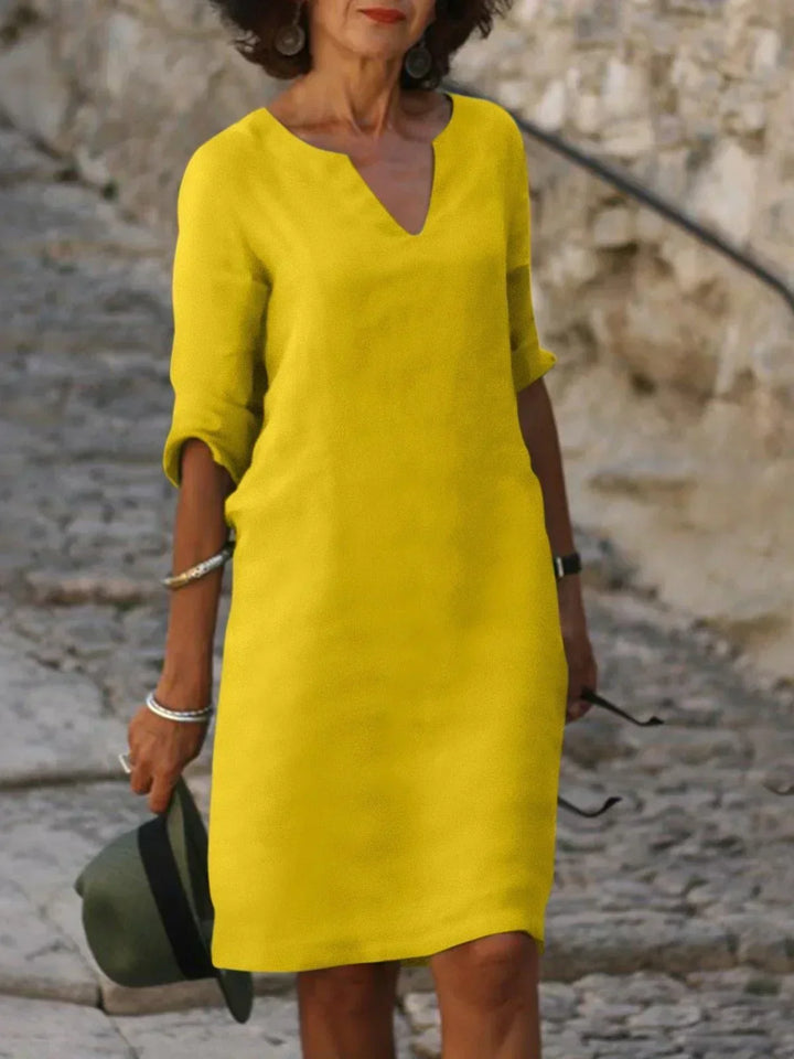 Robe femme polyvalente col V, contrôle ventre. Élégante pour la soirée, confortable pour le jour. Look tendance été.