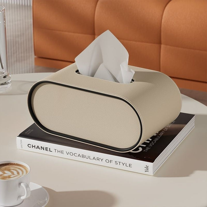 Boîte à mouchoirs rectangulaire arrondie en PU, design élégant pour un rangement discret et moderne.