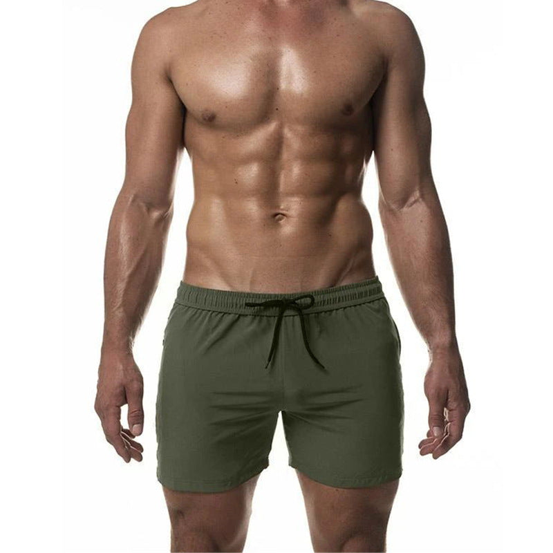 Short de bain d'entraînement homme séchage rapide, idéal natation et sports aquatiques. Confort optimal pour l'été.