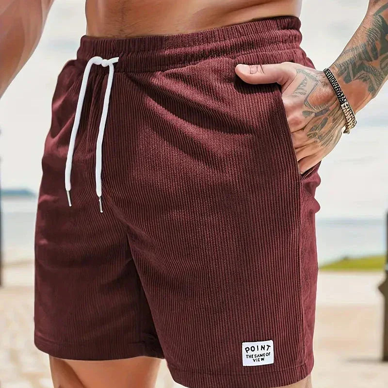 Short homme décontracté avec poches, coupe ample et taille à cordon, confort moderne et casual.