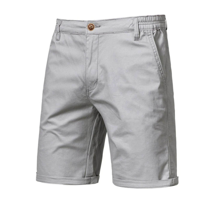 Ceinture élastique confortable du short homme extensible bleu, offrant un ajustement parfait pour l'été.