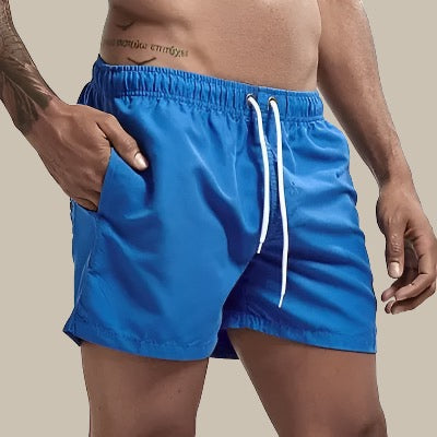 Short de bain homme uni, coloris tendance, polyvalent pour toute activité estivale.