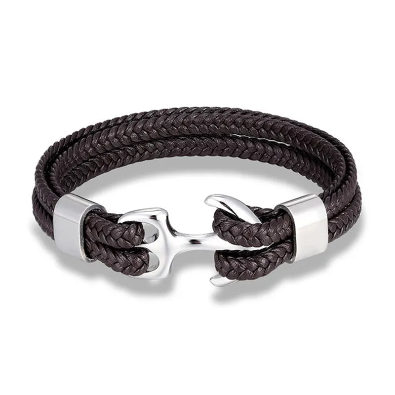 Détail : Fermoir ancre marine sur bracelet unisexe tressé, un bijou nautique moderne et chic pour le poignet.