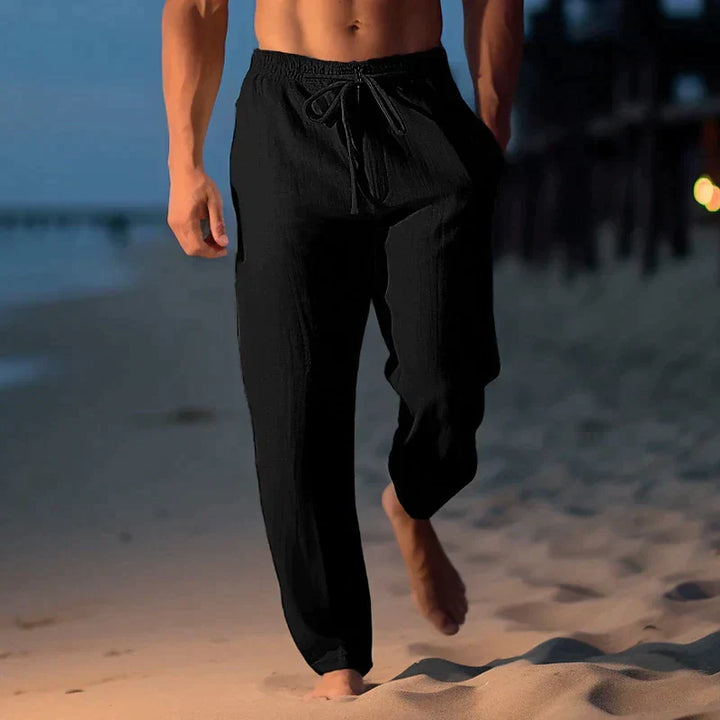 Pantalon d'été ample pour hommes, look décontracté-chic en lin. Idéal pour un style mode masculine estival.