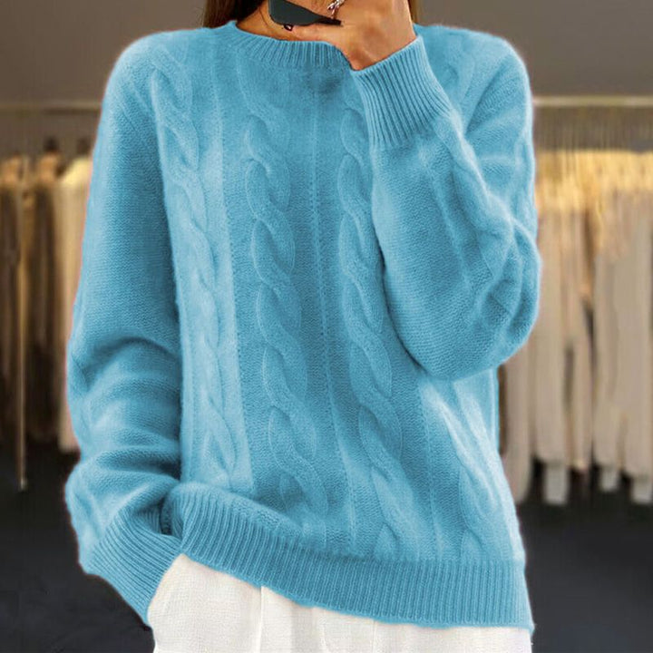 Pull femme torsadé élégant en maille douce, parfait pour un style quotidien chic et confortable en hiver.