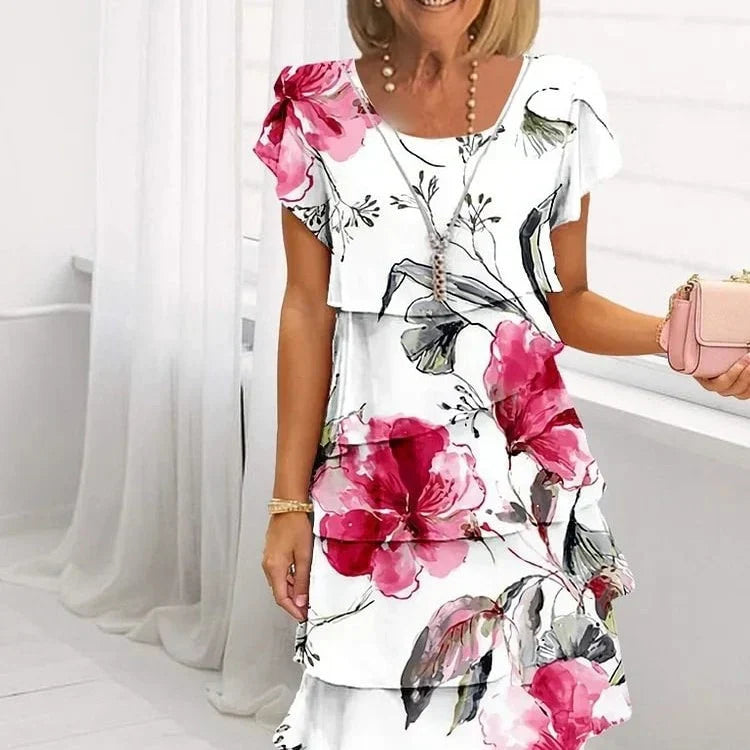 Robe d'été femme fleurie à volants, élégante et chic pour vacances ou soirée décontractée.