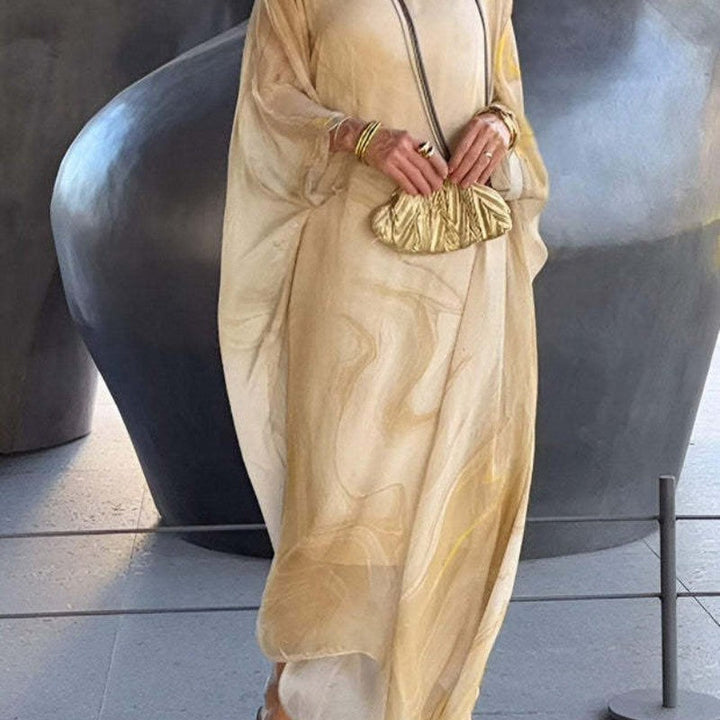 Robe d'été femme en chiffon fluide, longue et élégante, assurant confort et style en vacances.
