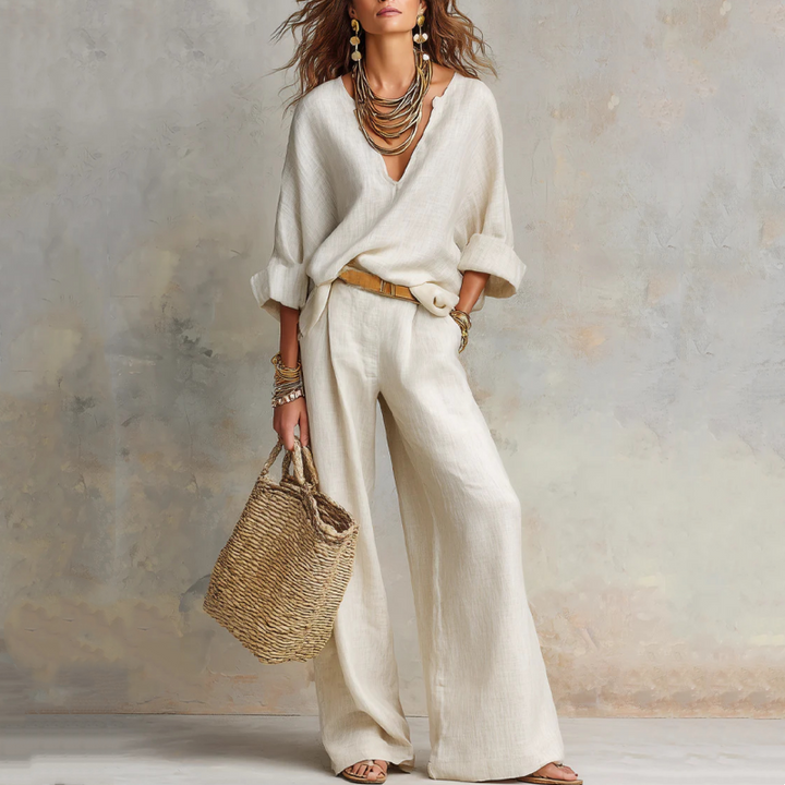 Ensemble deux pièces rose pour femme, pantalon large et haut fluide, style décontracté chic pour l'été.