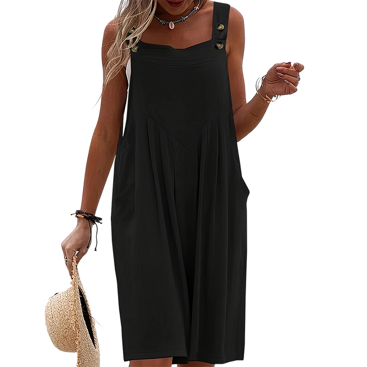 Tenue d'été femme: combinaison ample, bretelles boutonnées, sans manches, style décontracté chic.