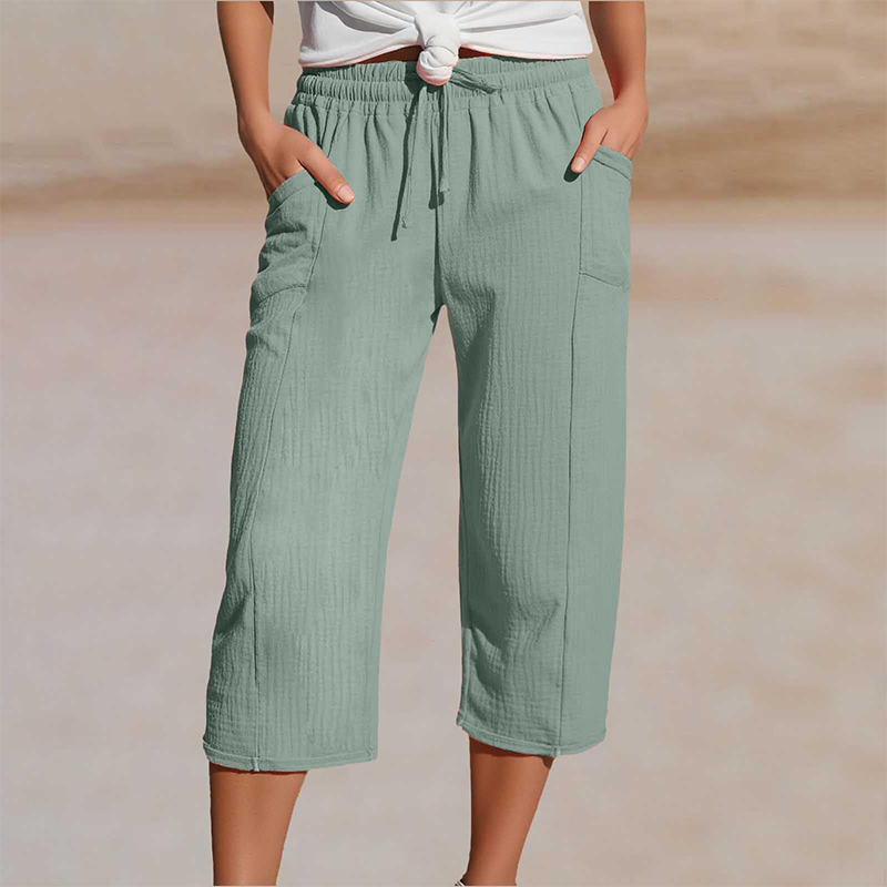 Pantalon cropped femme en coton lin, taille élastique, coupe décontractée pour l'été.