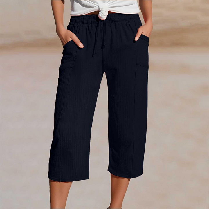 Pantalon cropped femme élégant, jambes larges en coton lin pour une mode décontractée.