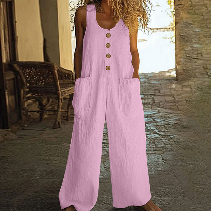 Combinaison estivale femme ample, sans manches, détails boutons décoratifs. Confort moderne et élégant.