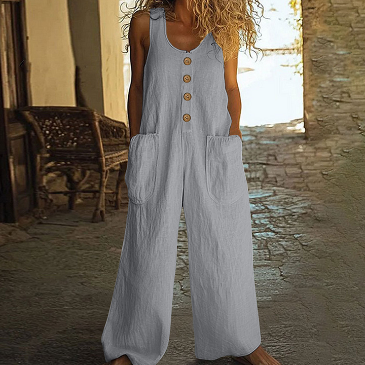 Style estival femme: Combinaison ample, sans manches, boutons décoratifs. Jambes larges pour liberté de mouvement.