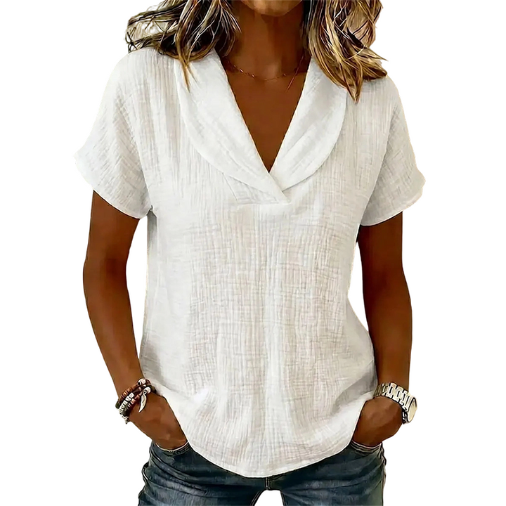 T-shirt ample femme décontracté chic, col V et tissu texturé, pour mode estivale confortable.