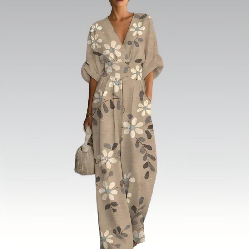 Combinaison fluide femme fleurie à col V, taille marquée, parfaite pour un look estival chic ou une soirée d'été.