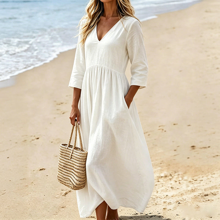 Robe fluide polyester pour femmes, col V, manches trois-quarts. Élégante et décontractée, très confortable.
