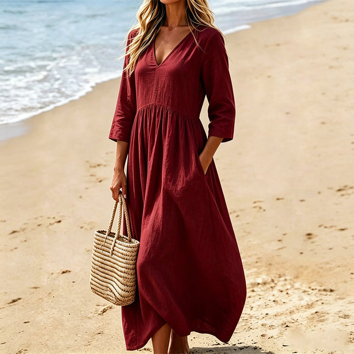 Robe longue élégante femme, coupe fluide, col V, manches trois-quarts. Confortable et parfaite pour toute occasion.