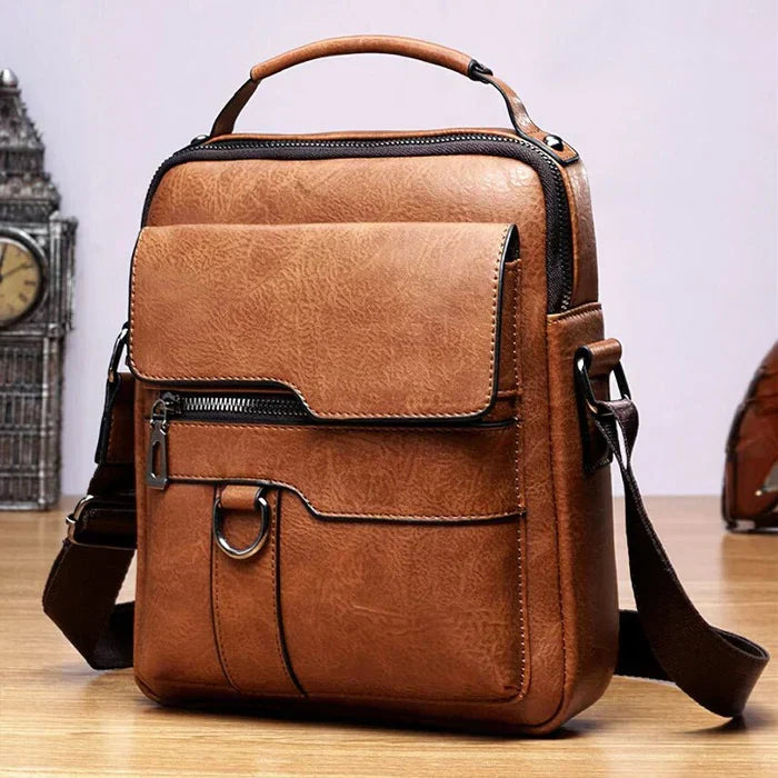 Sac noir en cuir PU avec bandoulière réglable, un classique intemporel unisexe.