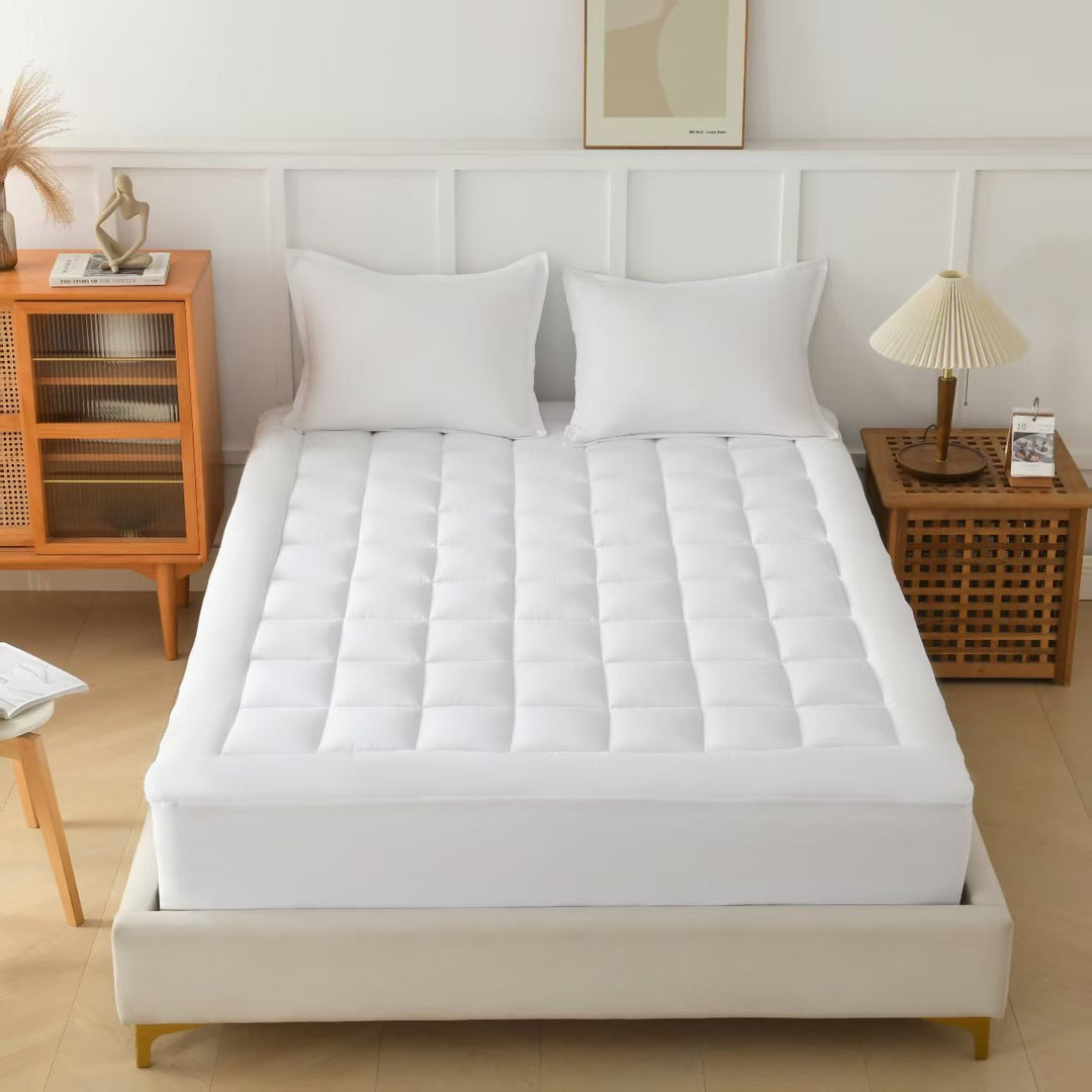 Surmatelas rafraîchissant et ergonomique pour un soutien optimal, améliorant la qualité du sommeil et le confort.