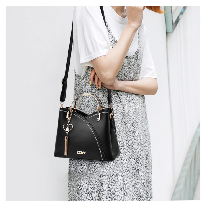 Sac bandoulière femme polyvalent avec sangle ajustable, idéal pour un look moderne et pratique.