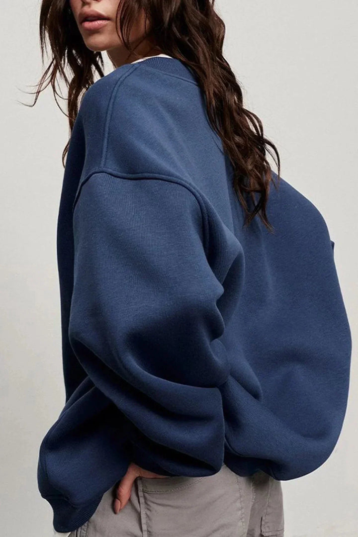 Sweatshirt pull femme oversize à col rond, doux au toucher, parfait pour l'hiver.