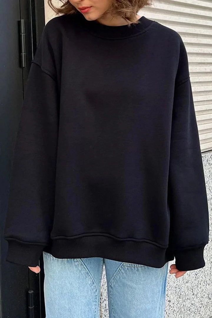 Tendance pull femme oversize, col rond, tissu respirant, parfait pour le printemps.