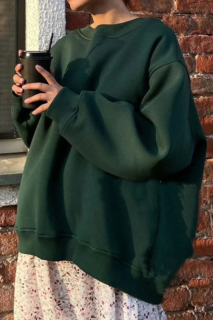 Sweatshirt décontracté femme, coupe oversize, col rond, idéal pour superposer en hiver.