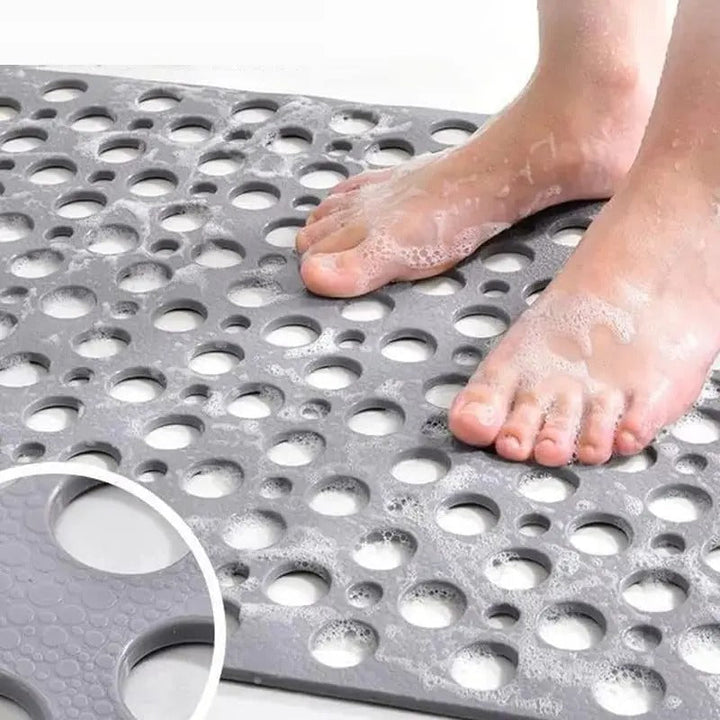 Tapis antidérapant avec ventouses offrant forte adhérence et drainage. Sécurité essentielle pour baignoire et douche.