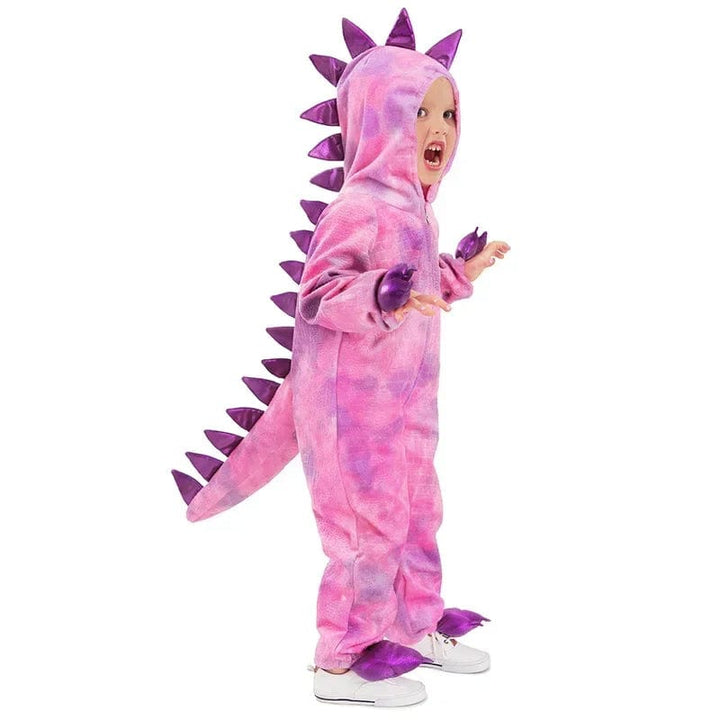 Enfant joyeux en déguisement dinosaure premium, prêt pour fête ou carnaval.