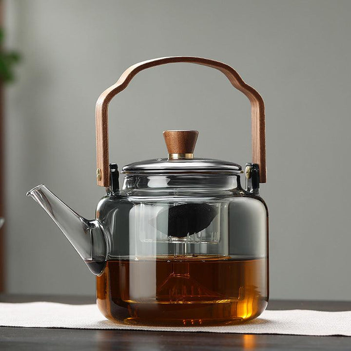 Théière élégante 1,2L en verre borosilicate et bois, pour une infusion parfaite de votre thé.