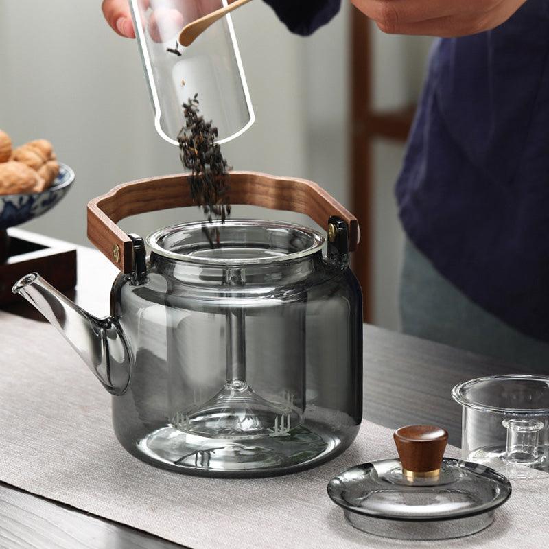 Théière design 1,2L avec infuseur, mélange de verre et bois, idéale pour un rituel du thé.