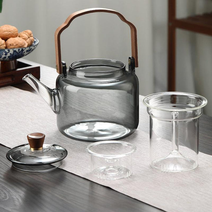 Théière chic de 1,2L, en verre avec poignée et couvercle en bois, parfaite pour servir le thé.